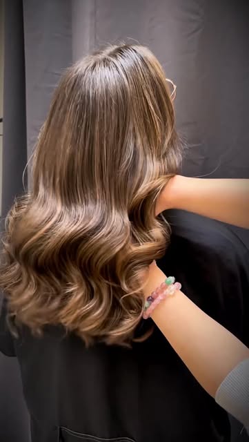 Glossy brunette waves finished at Lift Hair Studio