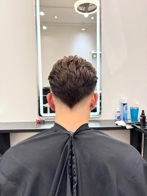 Clean tapered short haircut viewed from the back