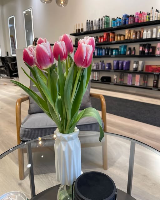 Pink tulips in the bright interior of Lift Hair Studio